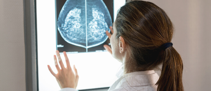 Female doctor looking at brain scan