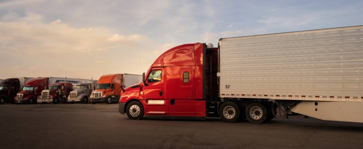 Red semi truck in a truck lot